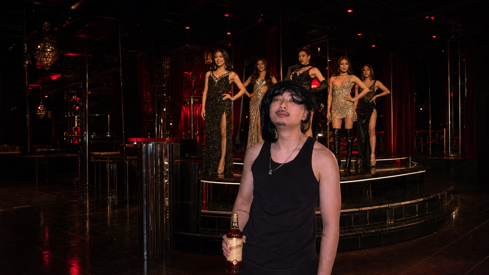Greg, the groom, holding a bottle of Mekhong in a Bangkok cabaret venue